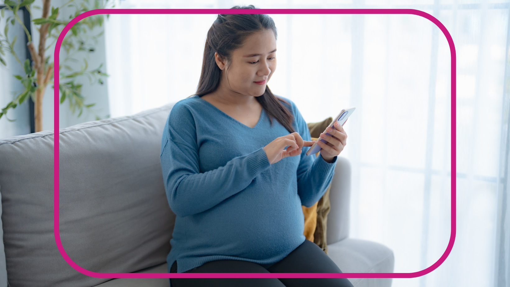 pregnant woman holding cell phone